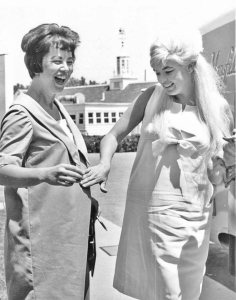 Actress Jayne Mansfield, right, feels the belly of pregnant reporter Gail Tabor in 1965 in Columbus, Ohio.